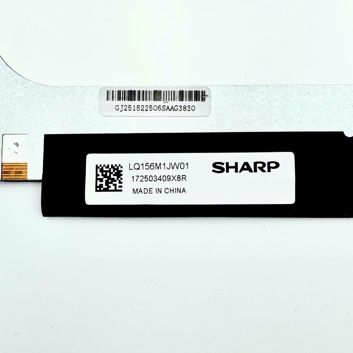 Label close-up of LQ156M1JW01 screen by Sharp with part number and batch code - compatible Full HD laptop screen in Georgia