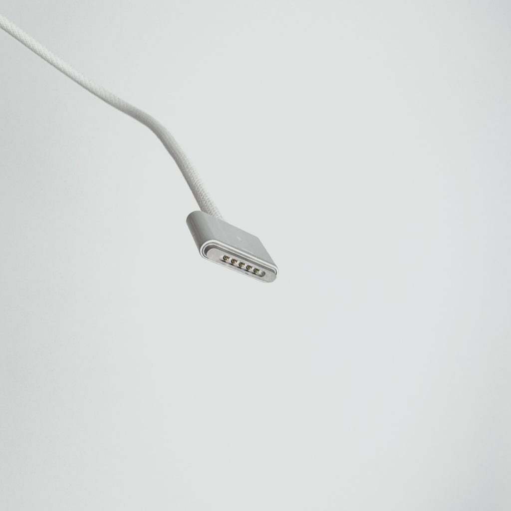 Close-up of Magsafe 3 cable connector for MacBook, silver color