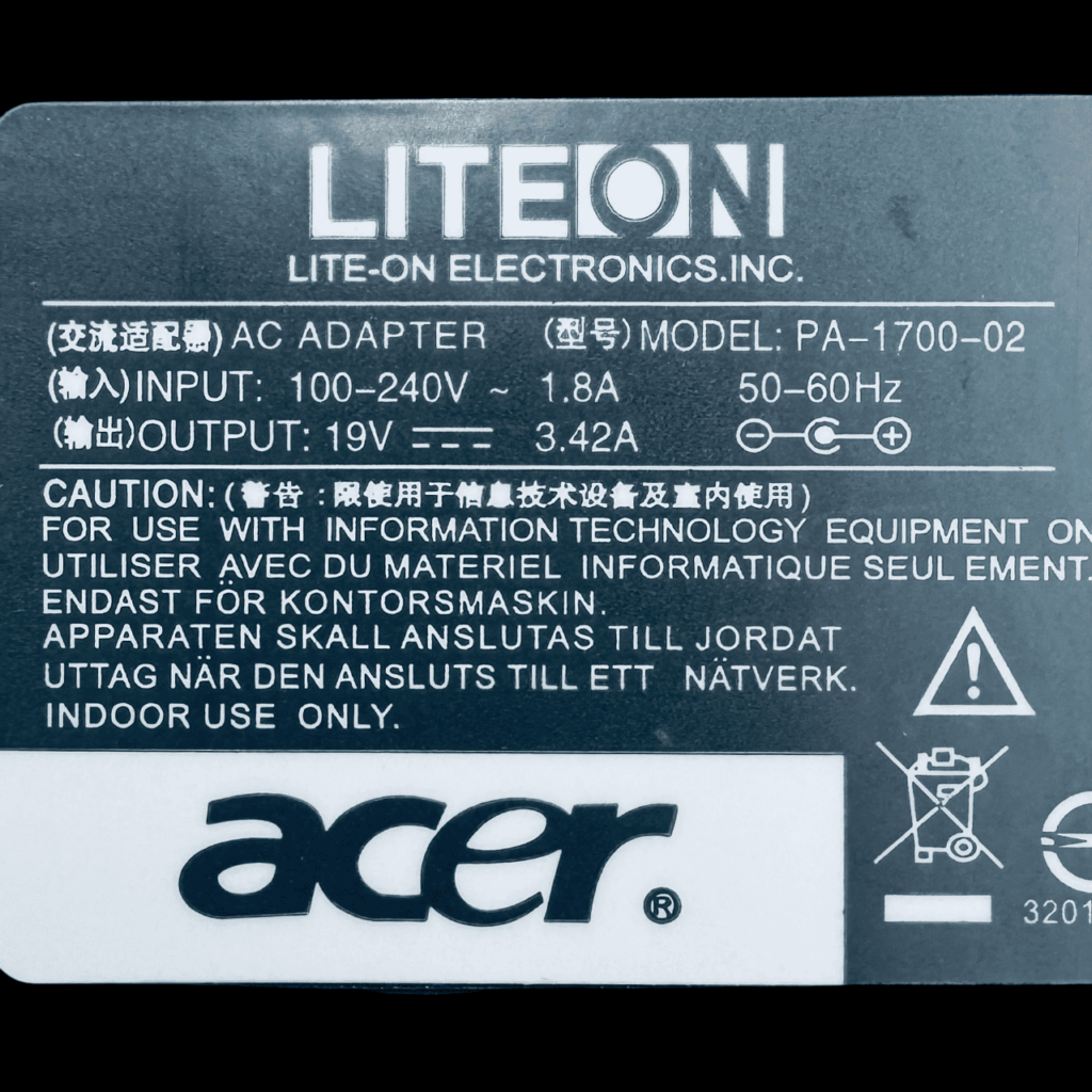 Acer 65W power adapter — close-up of label with specifications